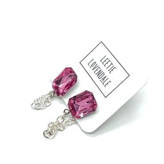 Pink crystal earrings on a white card with 'Lee Tie Lovendale' branding.