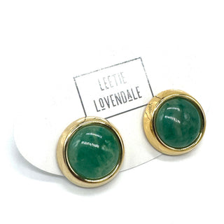 Gold-framed green lucite earrings on a white background with 'Leete Lovendale' branding.
