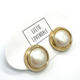 Pearl earrings with gold accents on a white background with 'Leette Lovendale' branding.