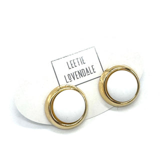 Gold and white stud earrings on a white card with 'Leetie Lovendale' branding.