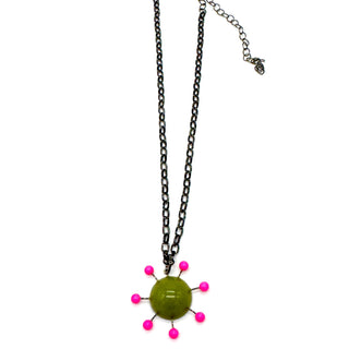 Olive green pendant with hot pink beads radiating around the center, reminiscent of the Sputnik satellite. Pendant hangs on an adjustable chain