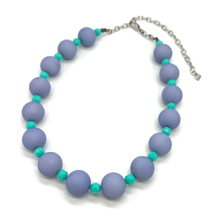 Adjustable necklace featuring chunky periwinkle lucite beads and smaller faceted turquoise spacers on a white background.