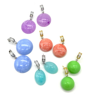 Brightly colored lucite earrings on a white background.