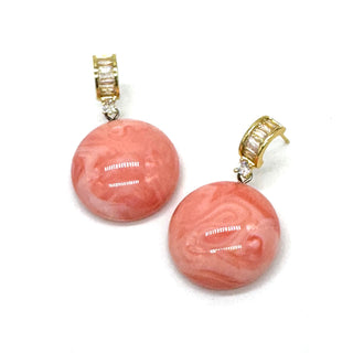 Coral pink swirled lucite drops dangle from crystal-embellished earwires.