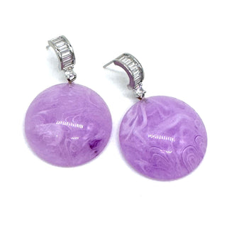 Lavender swirled lucite drops dangle from crystal-embellished earwires.