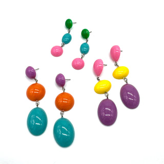 Colorful beaded earrings on a white background