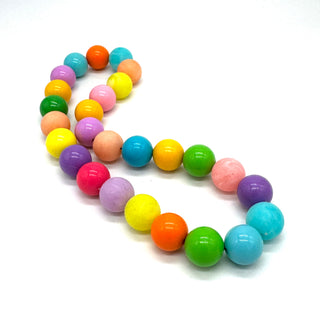 Colorful beaded bracelet on a white background
