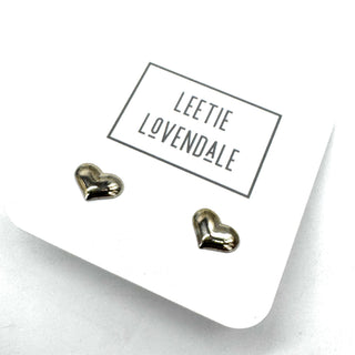 Heart-shaped earrings on a white card with 'Leetie Lovendale' branding.