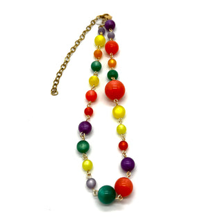 Colorful beaded necklace with a gold chain on a white background