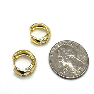 Silver and crystal hoop earrings with a quarter for scale.