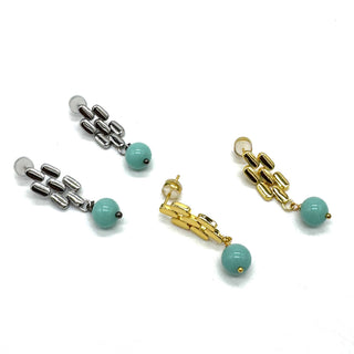 Silver and gold drop earrings with turquoise glass beads.