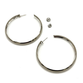 Large silver hoop earrings on a white background.