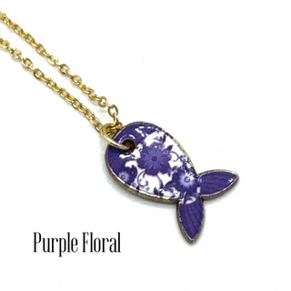 A gold chain necklace with a fish-shaped pendant featuring a purple and white floral pattern, with the text 'Purple Floral' printed below on a white background.