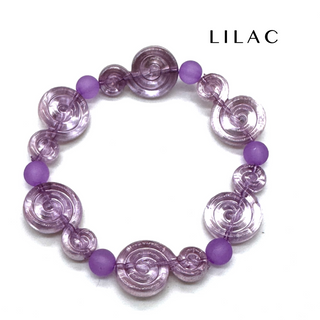 A lilac beaded stretch bracelet featuring translucent spiral-shaped beads and matte purple round beads, displayed on a clean white background with the brand name 'LILAC' printed in the upper right.