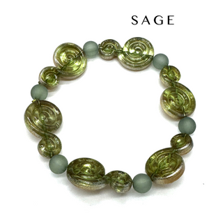 A beaded stretch bracelet featuring textured olive green spiral beads and matte sage green round beads, displayed on a clean white background with the brand name 'SAGE' printed above.