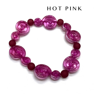 A beaded stretch bracelet featuring translucent hot pink spiral beads and matte dark pink round beads, displayed on a clean white background with 'HOT PINK' text above.