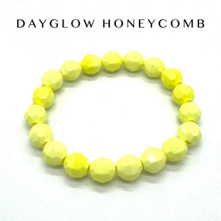 Yellow beaded bracelet on a white background with 'Dayglow Honeycomb' text.
