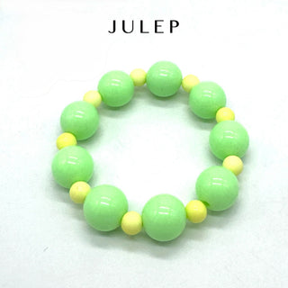 Green and yellow beaded bracelet on a white background with 'JULEP' branding.
